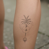 Tatuaggio palma che segue il sole