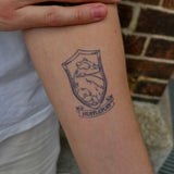 Tatuaggio Harry Potter Stemma House of Hufflepuff 