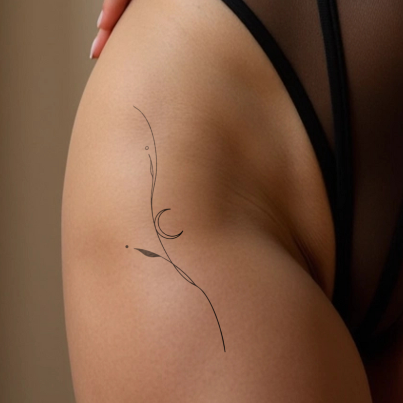 Tatuaggio pianta filigranata con luna